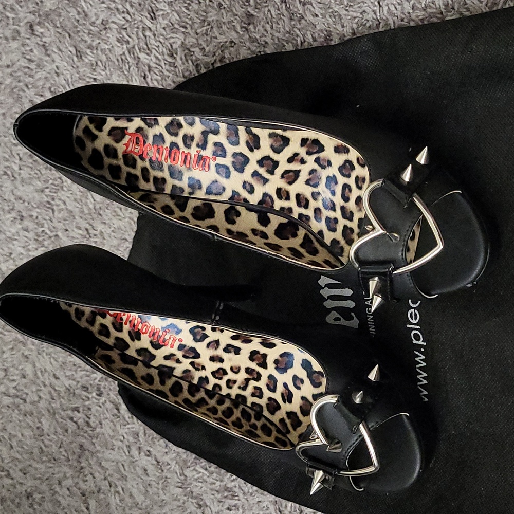 Demonia “Pixie-15” spiked peep toe high heel.